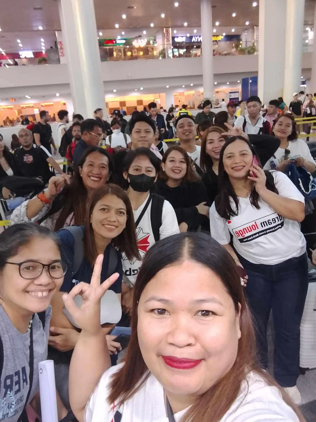 Dream Lounge travelers taking a group selfie at the airport